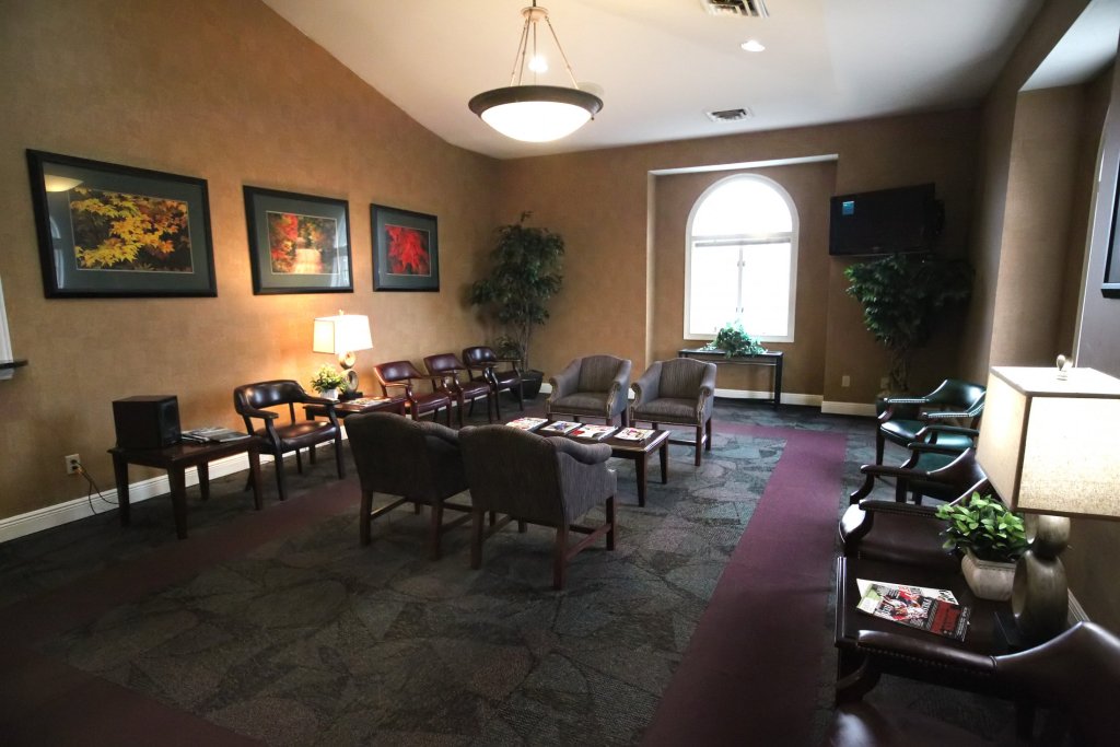 Inside, waiting room at {PRACTICE_NAME}
